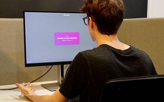 Participants were asked to perform a task once on their own and once supposedly aided by an AI system. Image: Otso Haavisto / Aalto University